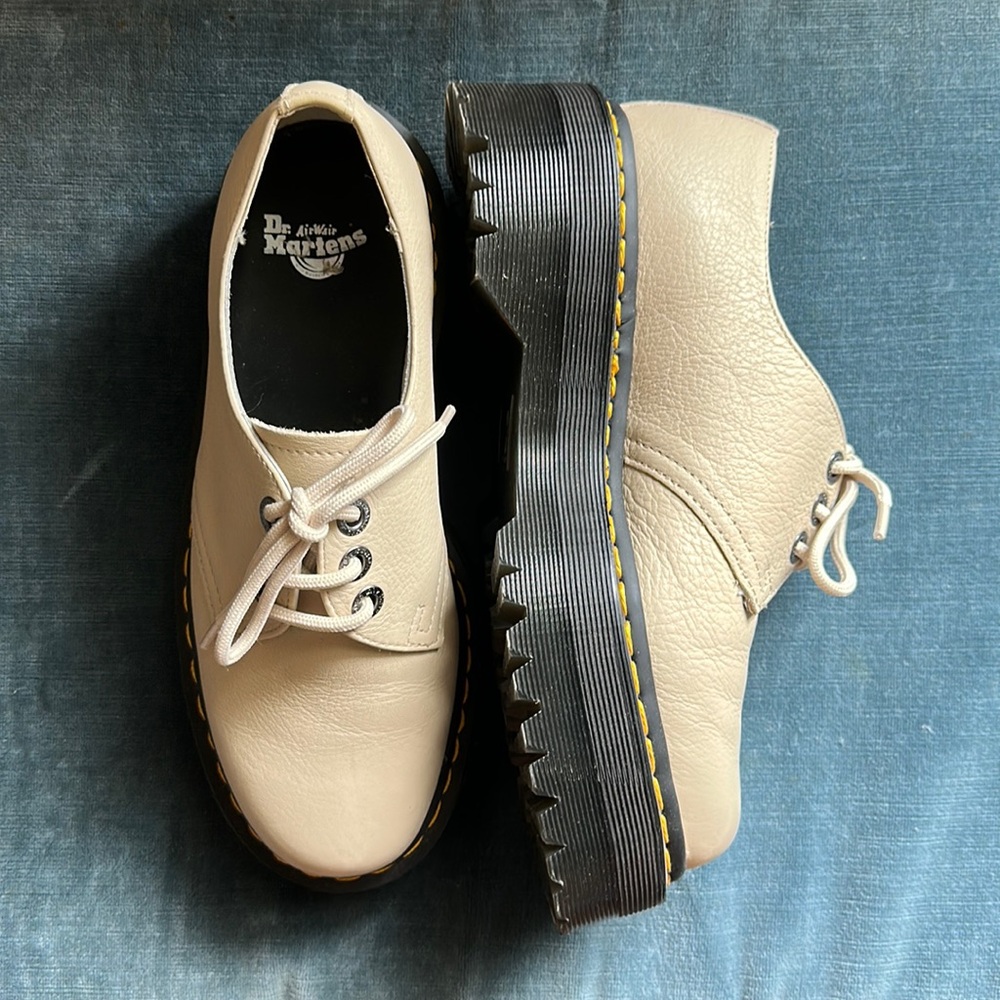 Dr. Martens platform shoes in a parchment beige